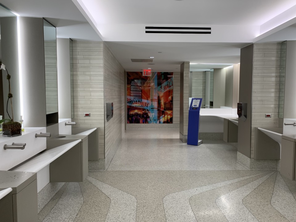 a bathroom with a blue stand