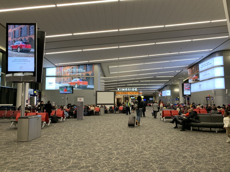 a group of people in an airport terminal