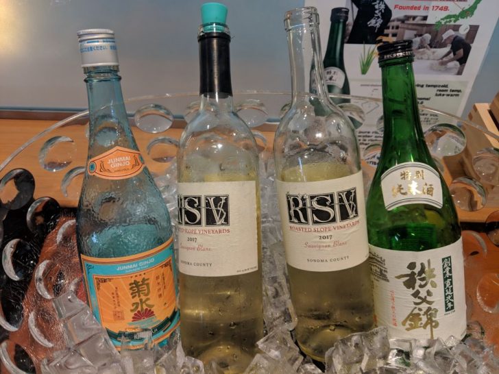 a group of bottles on ice
