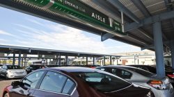 a group of cars parked under a canopy