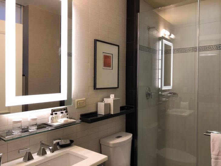 a bathroom with a mirror and sink