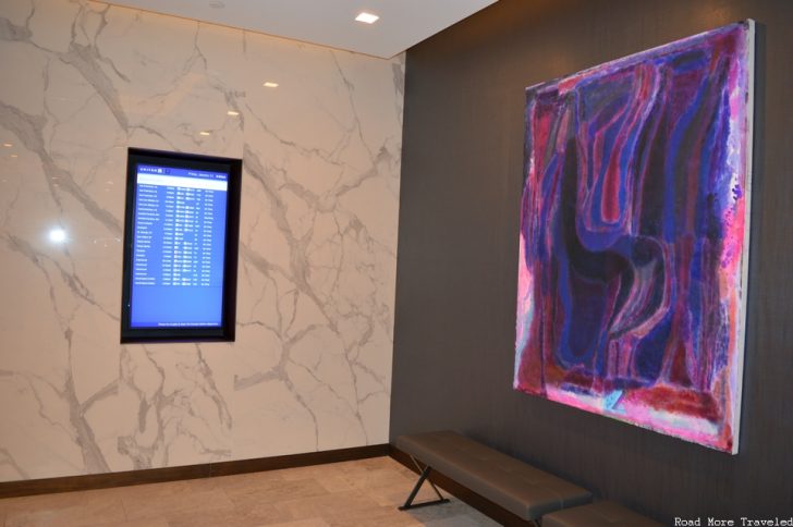 United Polaris Lounge Los Angeles - departures board and art