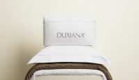 a pillow on top of a bed