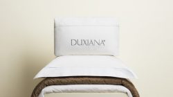 a pillow on top of a bed