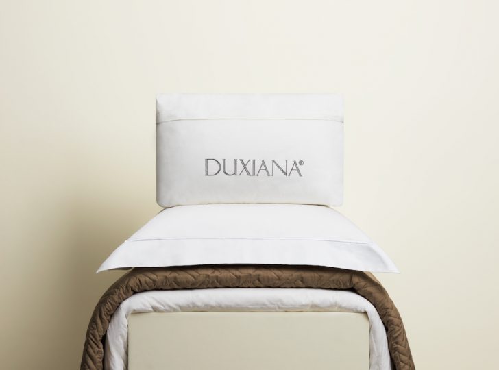 a pillow on top of a bed