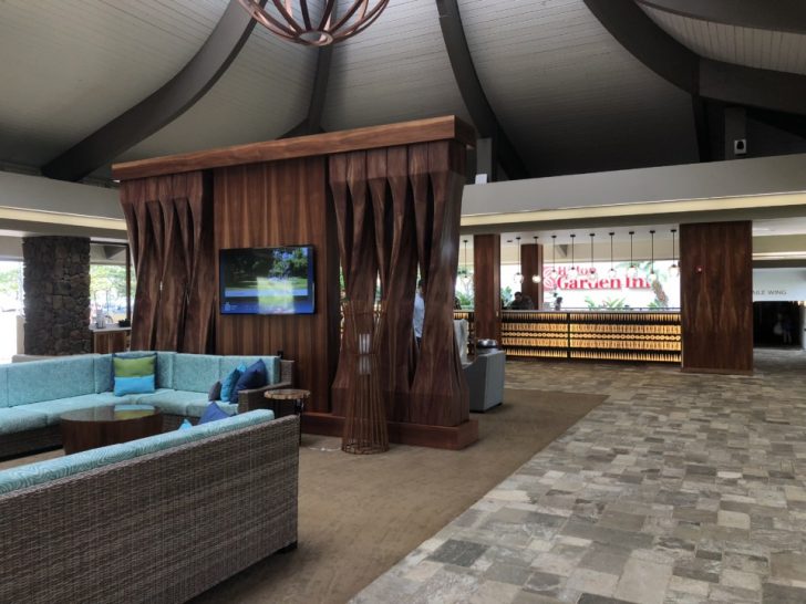 a room with a tv and couches
