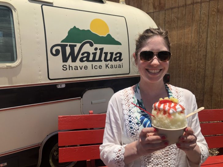 a woman holding a bowl of ice cream