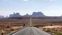 a road leading to a desert landscape