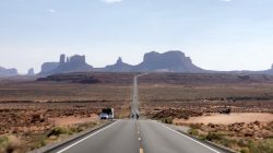 a road leading to a desert landscape