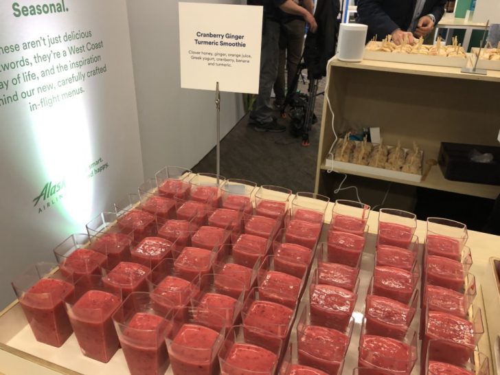 a table with many cups of smoothies