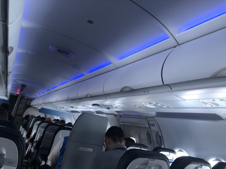 a group of people sitting on an airplane