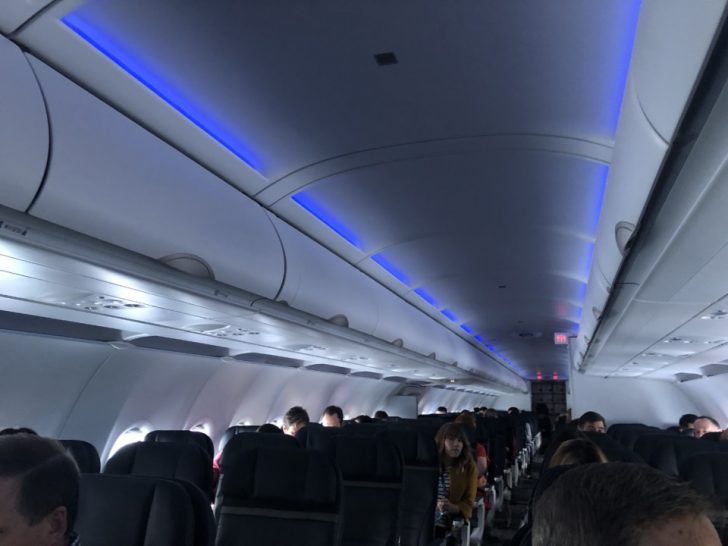 a plane with people sitting in seats