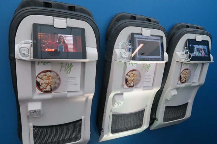 a group of luggage with a screen on it