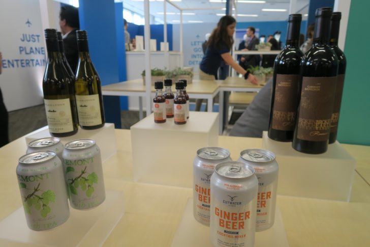 a group of bottles and cans of beer