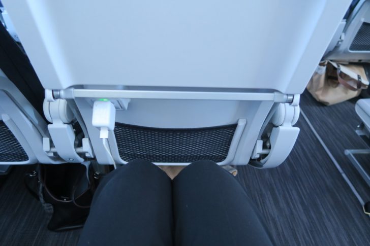 a person's legs and a seat