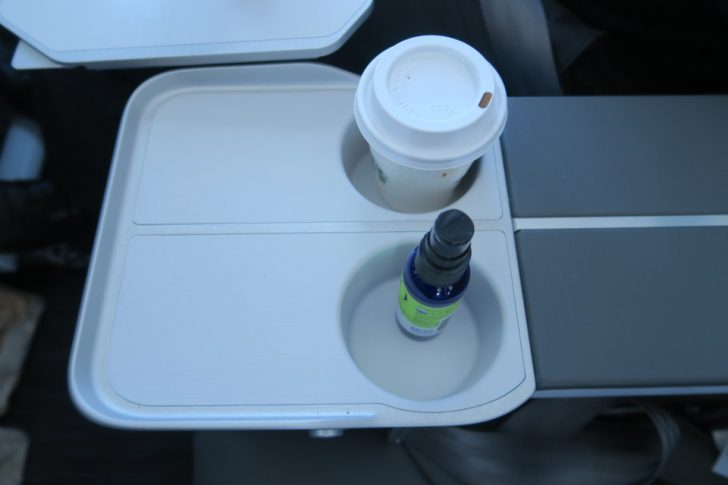 a drink and a bottle on a tray