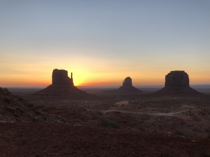 a sunset over a desert