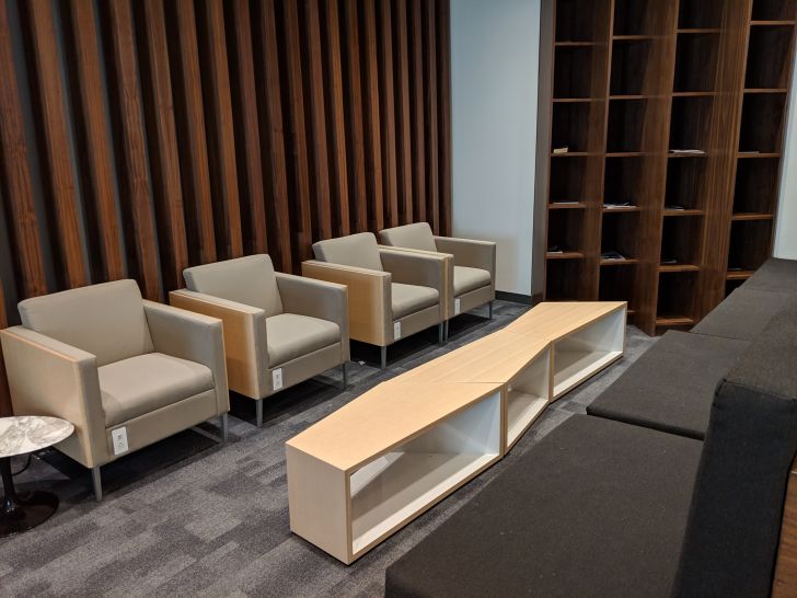 a room with chairs and a shelf