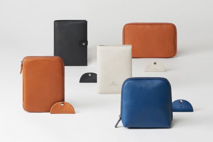several wallets on a white surface
