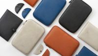 a group of different colored wallets