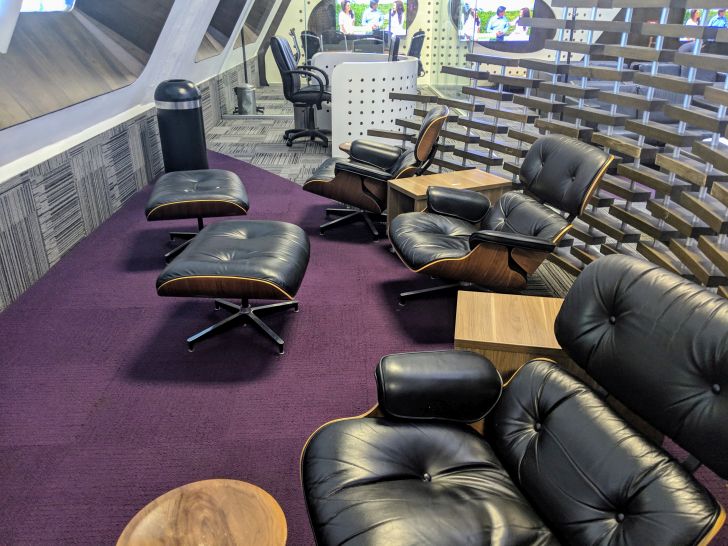a room with black chairs and tables