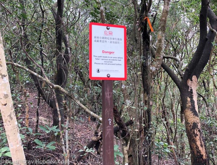 a sign in the woods