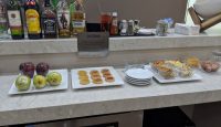 a counter with food and drinks on it