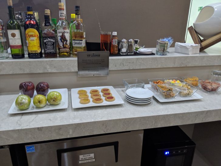 a counter with food and drinks on it