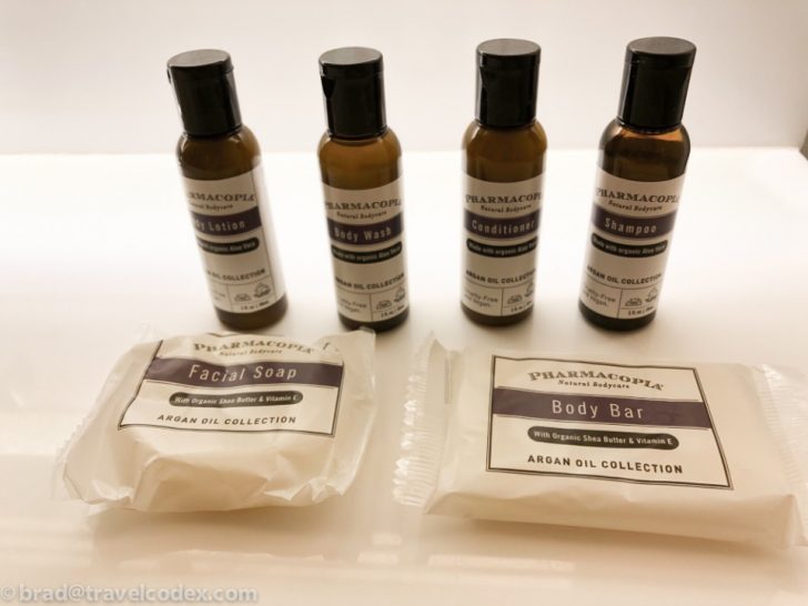 a group of bottles and packages of soap