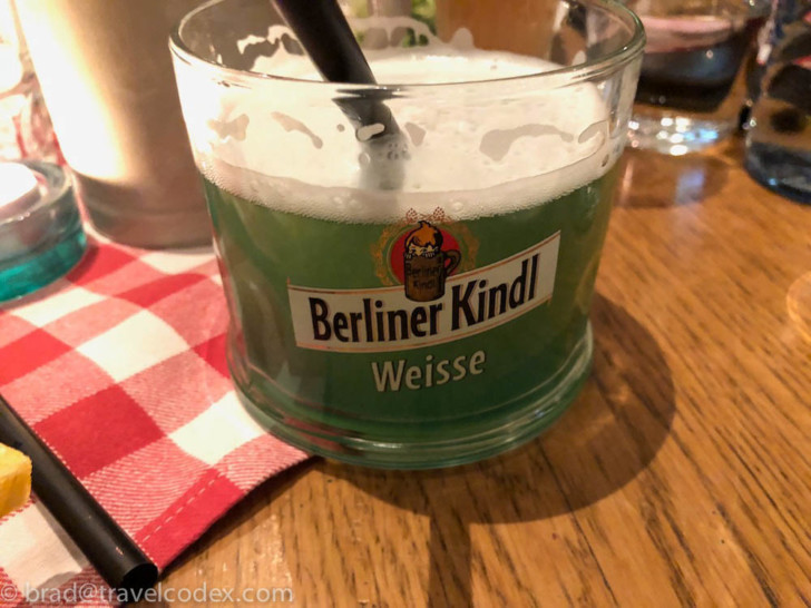 a glass of beer on a table