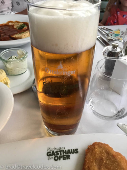 a glass of beer on a table