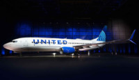 a white airplane in a dark room