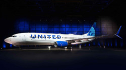 a white airplane in a dark room