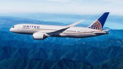 a plane flying over mountains