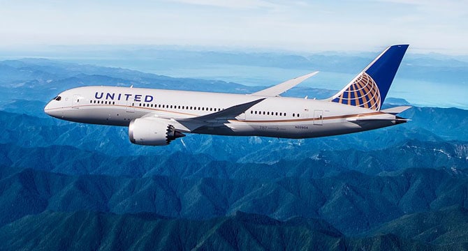 a plane flying over mountains