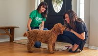 two women with a dog