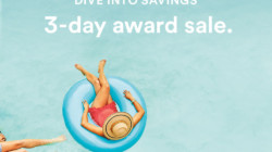a woman floating on a blue tube in a pool