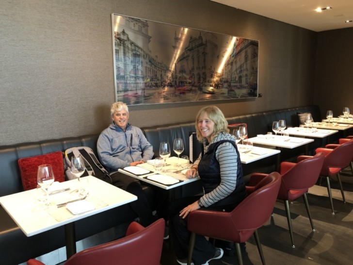 a couple of people sitting at a table