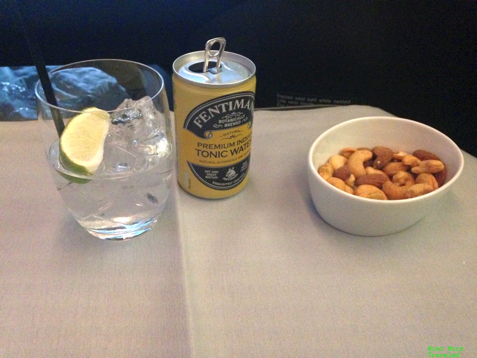 Gin and tonic with mixed nuts