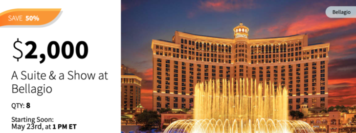 a large building with a fountain in front of it