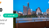 a city skyline with a river and trees