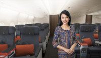 a woman standing in an airplane