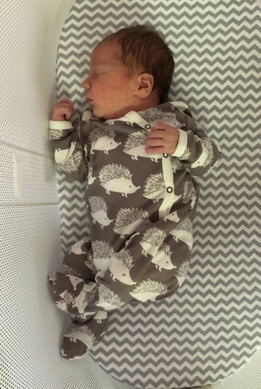 a baby sleeping in a crib
