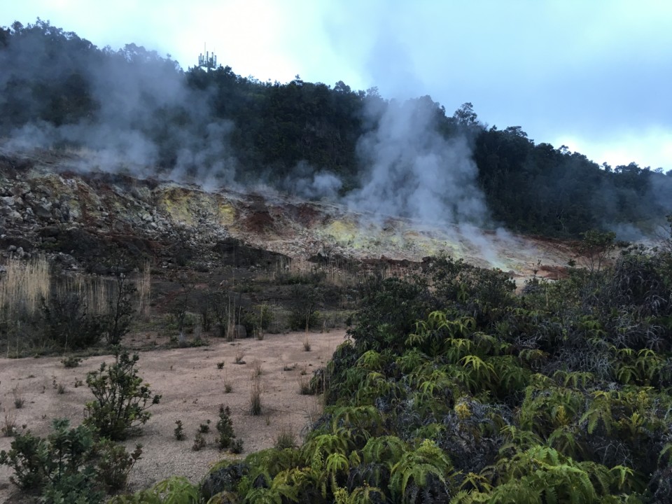 a smoke coming out of a mountain