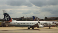 a white airplane on a runway