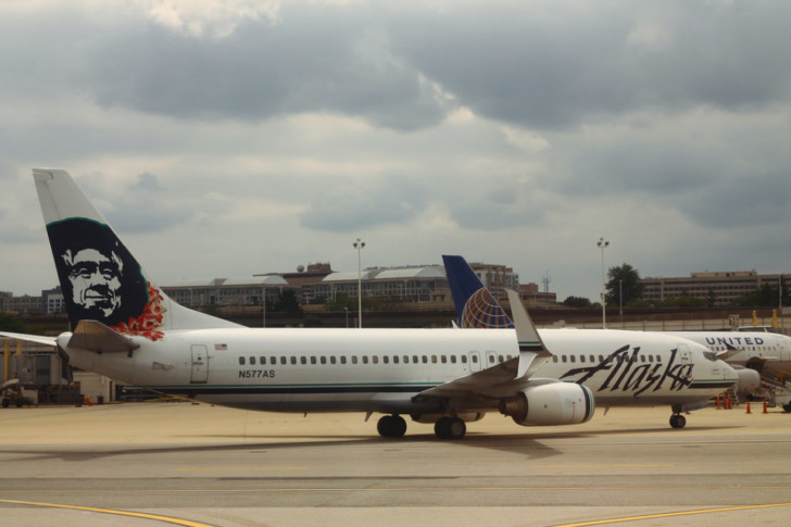 a white airplane on a runway