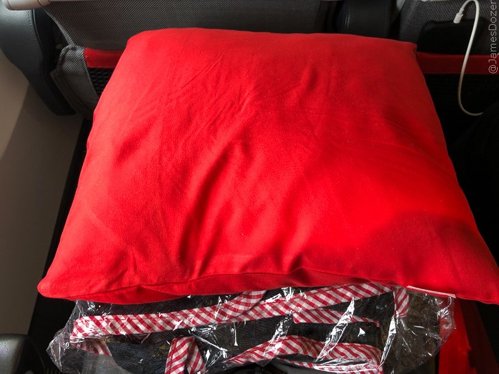 a red pillow on a chair