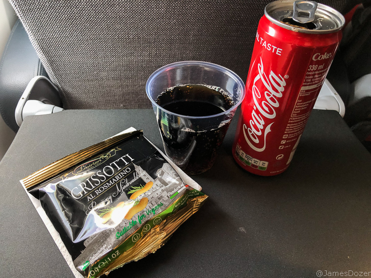 a can of soda and a packet of chips