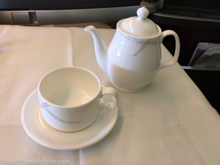 a teapot and a cup on a table