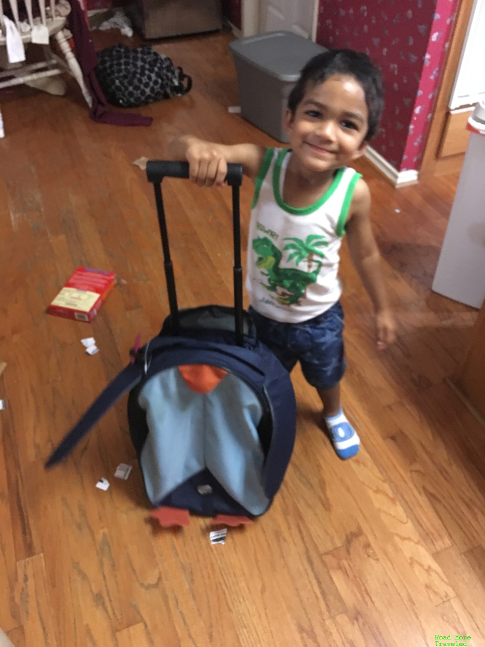 Ashok rolling his suitcase